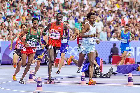 Athletes compete in the Men's 3000m Steeplechase Round 1